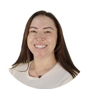 Portrait of a smiling woman with long brown hair, wearing a light beige top, in a circular crop on a white background.